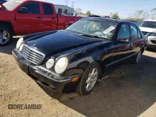 2001 Mercedes-Benz E-Class with VIN WDBJF65J01B325792, listed as a Copart auction lot 76328704 with 101,886 mi miles and Salvage Title. Bid and sale history available at carsss.com. Image 1.