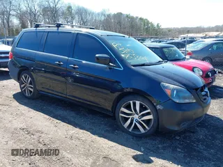 2009 Honda Odyssey EX-L with VIN 5FNRL38759B055396, listed as a IAAI auction lot 41863703 with 999,999 mi miles. Bid and sale history available at carsss.com. Image 1.