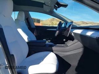 2023 Tesla Model 3 with VIN 5YJ3E1EAXPF486639, listed as a IAAI auction lot 41387797 with 18,603 mi miles and . Bid and sale history available at carsss.com. Image 5.