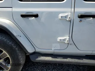 2019 Jeep Wrangler Unlimited Sahara with VIN 1C4HJXEG8KW574005, listed as a Copart auction lot 55386585 with Not provided miles and Salvage title. Bid and sale history available at DreamBid. Image 12.