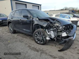 2024 Mazda CX-5 2.5 Turbo Signature with VIN JM3KFBXY7R0515256, listed as a Copart auction lot 87404694 with 4,699 mi miles and Salvage Title. Bid and sale history available at carsss.com. Image 4.