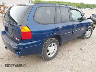 2003 GMC Envoy SLT z VIN 1GKDS13S532309264, wystawiony jako IAAI lot #42200597 z przebiegiem 86 728 mil mil oraz . Historia ofert i sprzedaży dostępna na DreamBid. Obrazek 4.