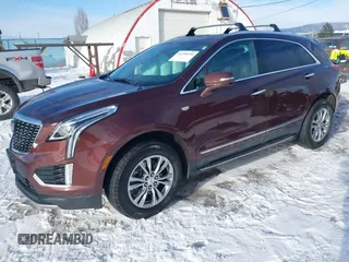 2022 Cadillac XT5 AWD Premium Luxury with VIN 1GYKNDRS9NZ128658, listed as a IAAI auction lot 41330193 with 34,361 mi miles and . Bid and sale history available at DreamBid. Image 2.