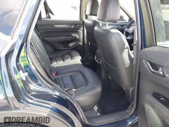 2021 Mazda CX-5 Grand Touring with VIN JM3KFBDM6M1312573, listed as a IAAI auction lot 41936739 with Not Provided miles and . Bid and sale history available at DreamBid. Image 8.