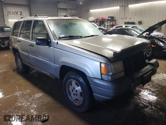 1997 Jeep Grand Cherokee Laredo with VIN 1J4GZ58Y7VC650813, listed as a Copart auction lot 41486724 with 266,004 mi miles and Salvage Title. Bid and sale history available at carsss.com. Image 4.
