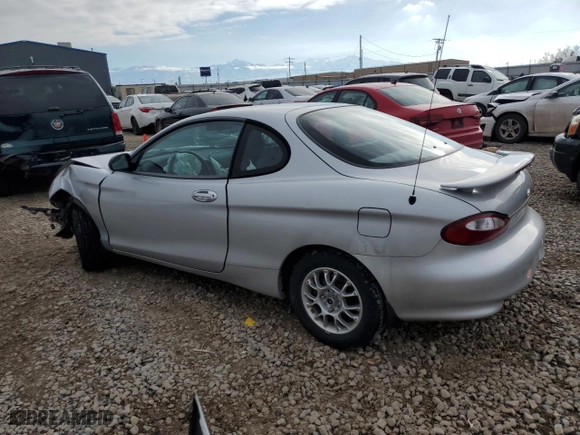 1999 Hyundai Tiburon with VIN KMHJG24F8XU126762, listed as a Copart auction lot 88747725 with 51,296 mi miles and Salvage Title. Bid and sale history available at carsss.com. Image 2.