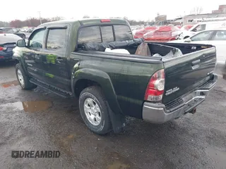 2013 Toyota Tacoma with VIN 3TMLU4EN3DM123470, listed as a IAAI auction lot 41952721 with 72,296 mi miles and . Bid and sale history available at DreamBid. Image 3.