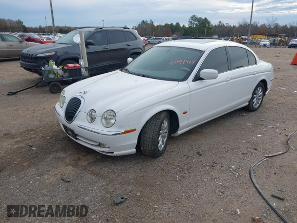 2002 Jaguar S-Type with VIN SAJDA01P12GM35163, listed as a IAAI auction lot 41097415 with 114,017 mi miles and . Bid and sale history available at DreamBid. Image 2.
