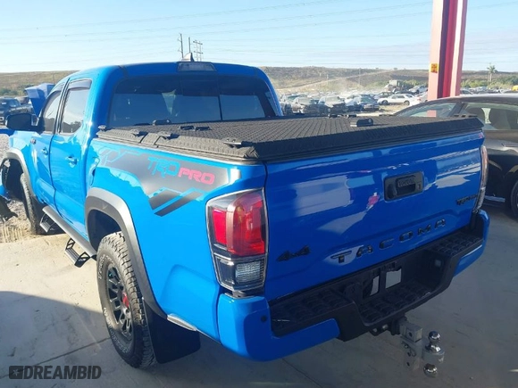 2019 Toyota Tacoma 4WD SR with VIN 5TFCZ5AN9KX197898, listed as a IAAI auction lot 41304019 with 111,995 mi miles. Bid and sale history available at carsss.com. Image 3.