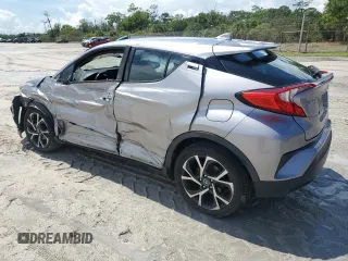2018 Toyota C-HR XLE with VIN NMTKHMBX7JR021704, listed as a Copart auction lot 71171874 with 82,872 mi miles and Salvage Title. Bid and sale history available at DreamBid. Image 2.