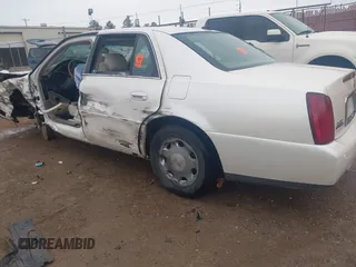 2002 Cadillac DeVille DHS z VIN 1G6KE57YX2U212020, wystawiony jako IAAI lot #41287342 z przebiegiem Nie podano mil oraz . Historia ofert i sprzedaży dostępna na DreamBid. Obrazek 3.