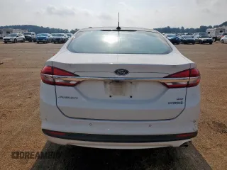 2018 Ford Fusion SE z VIN 3FA6P0LU7JR141756, wystawiony jako Copart lot #57490345 z przebiegiem Nie podano mil oraz Szkoda całkowita • Salvage title. Historia ofert i sprzedaży dostępna na DreamBid. Obrazek 6.