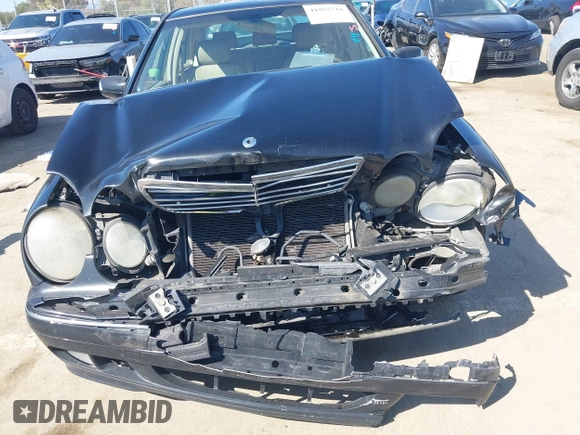 2001 Mercedes-Benz E-Class with VIN WDBJF65J11B368277, listed as a IAAI auction lot 41855716 with 207,864 mi miles. Bid and sale history available at carsss.com. Image 6.