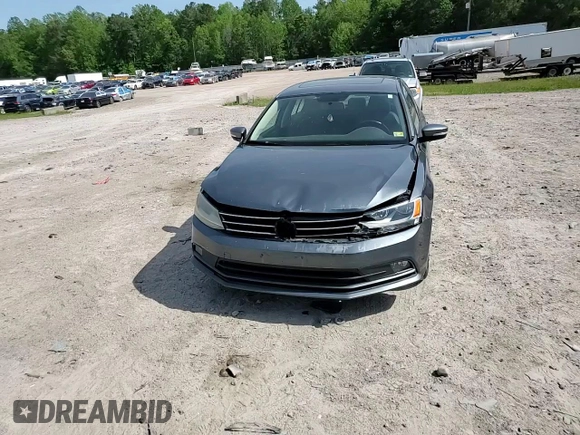 2015 Volkswagen Jetta SE z VIN 3VWD17AJ5FM309965, wystawiony jako Copart lot #54930665 z przebiegiem 141 918 mil mil oraz Szkoda całkowita • Salvage title. Historia ofert i sprzedaży dostępna na DreamBid. Obrazek 13.