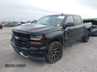 2017 Chevrolet Silverado 1500 LT with VIN 1GCUKREC2HF208232, listed as a IAAI auction lot 40933445 with 105,928 mi miles and . Bid and sale history available at DreamBid. Image 2.