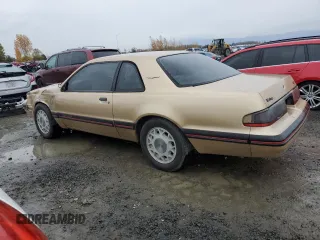 1987 Ford Thunderbird with VIN 1FABP64W7HH137025, listed as a Copart auction lot 80162264 with 137,140 mi miles and Salvage Title. Bid and sale history available at DreamBid. Image 2.