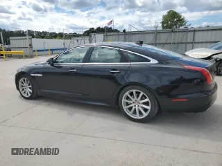 2018 Jaguar XJ with VIN SAJWA1C76J8W14271, listed as a Copart auction lot 73777914 with 124,155 mi miles and Salvage Title. Bid and sale history available at carsss.com. Image 2.