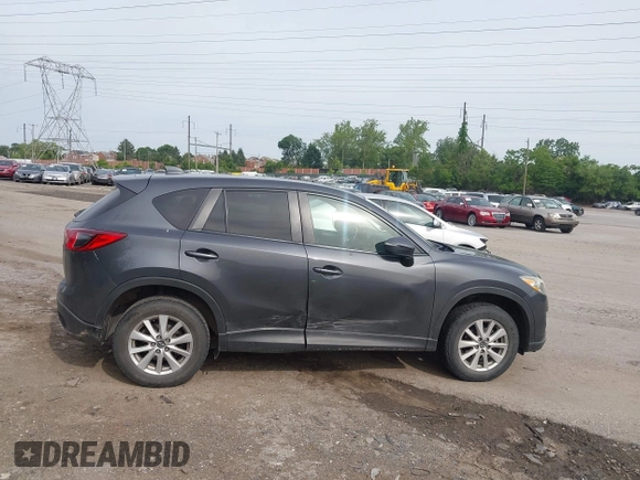 2014 Mazda CX-5 Touring z VIN JM3KE4CY2E0348500, wystawiony jako IAAI lot #42318155 z przebiegiem 182 616 mil mil oraz . Historia ofert i sprzedaży dostępna na DreamBid. Obrazek 13.