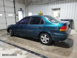 1997 Honda Civic LX with VIN 1HGEJ6572VL027980, listed as a Copart auction lot 53024335 with 269,396 mi miles and Salvage Title. Bid and sale history available at carsss.com. Image 2.