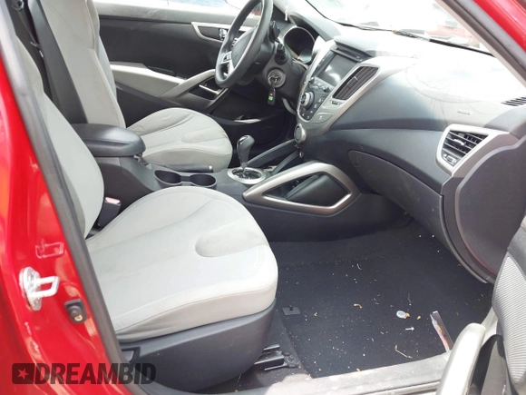 2012 Hyundai Veloster w/Black Int with VIN KMHTC6AD7CU049570, listed as a IAAI auction lot 42265051 with 79,896 mi miles and . Bid and sale history available at DreamBid. Image 5.