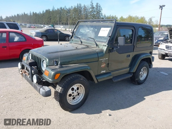 1997 Jeep Wrangler Sahara with VIN 1J4FY49S4VP523156, listed as a IAAI auction lot 42046797 with 193,408 mi miles. Bid and sale history available at carsss.com. Image 2.