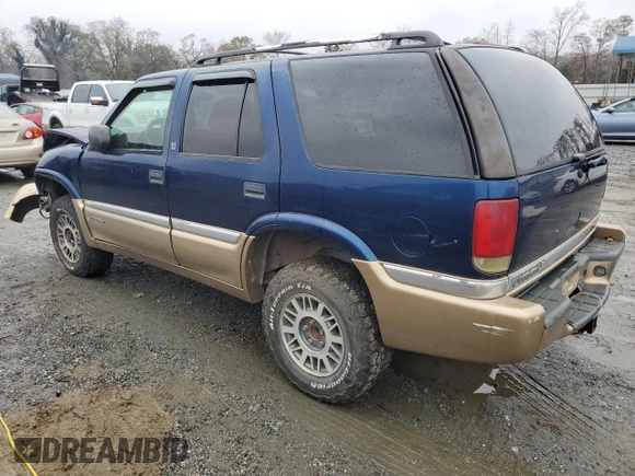1999 GMC Jimmy SLE z VIN 1GKDT13W8X2545509, wystawiony jako Copart lot #81608944 z przebiegiem 130 881 mil mil oraz Szkoda całkowita • Salvage title. Historia ofert i sprzedaży dostępna na DreamBid. Obrazek 2.