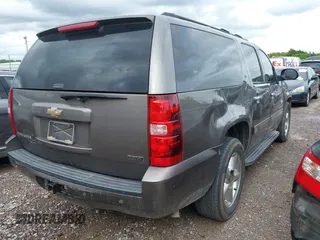 2011 Chevrolet Suburban LT with VIN 1GNSCJE03BR267184, listed as a IAAI auction lot 42156424 with 307,618 mi miles. Bid and sale history available at carsss.com. Image 4.