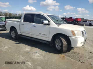 2005 Nissan Titan SE with VIN 1N6BA07B45N557451, listed as a Copart auction lot 80077824 with Not Provided miles and Salvage Title. Bid and sale history available at DreamBid. Image 4.
