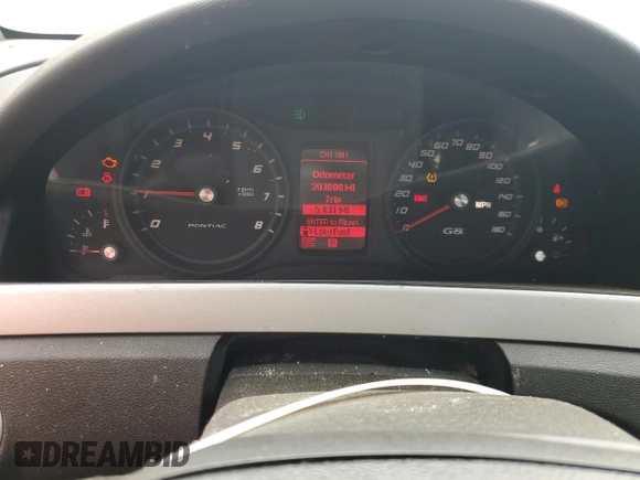 2009 Pontiac G8 z VIN 6G2ER57709L240146, wystawiony jako Copart lot #49223415 z przebiegiem 203 008 mil mil oraz Czysty tytuł • Clean title. Historia ofert i sprzedaży dostępna na DreamBid. Obrazek 9.