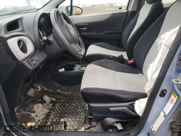 2012 Toyota Yaris L with VIN JTDKTUD33CD517298, listed as a Copart auction lot 52099335 with Not Provided miles and Salvage Title. Bid and sale history available at DreamBid. Image 7.