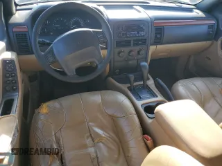 1999 Jeep Grand Cherokee Laredo z VIN 1J4GW58NXXC704719, wystawiony jako Copart lot #49546395 z przebiegiem 276 716 mil mil oraz Czysty tytuł • Clean title. Historia ofert i sprzedaży dostępna na DreamBid. Obrazek 8.