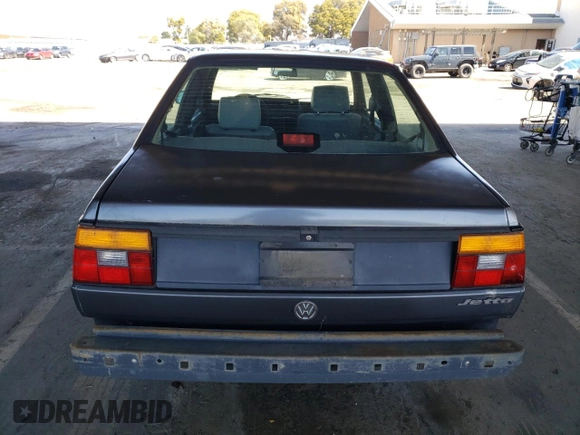 1989 Volkswagen Jetta z VIN WVWKB01G2KW684385, wystawiony jako Copart lot #49694065 z przebiegiem 63 792 mil mil oraz Czysty tytuł • Clean title. Historia ofert i sprzedaży dostępna na DreamBid. Obrazek 6.