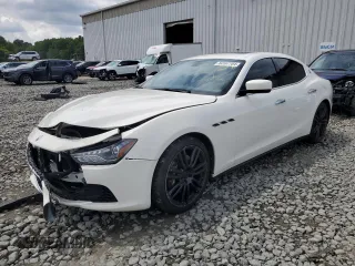 2015 Maserati Ghibli with VIN ZAM57XSAXF1141527, listed as a Copart auction lot 64167704 with 82,301 mi miles and Salvage title. Bid and sale history available at DreamBid. Image 1.
