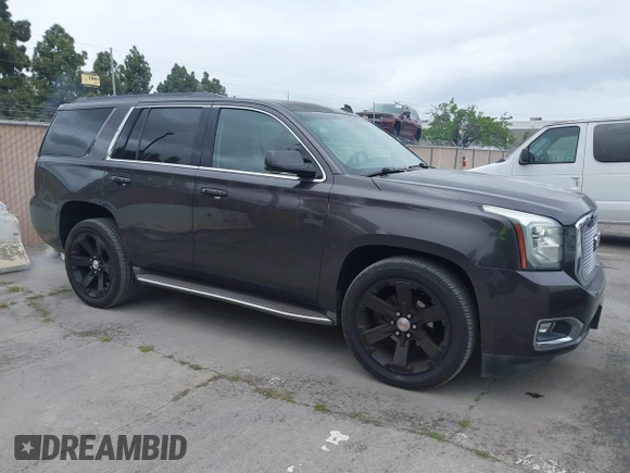 2015 GMC Yukon SLT with VIN 1GKS1BKC6FR245564, listed as a IAAI auction lot 42139295 with 149,088 mi miles. Bid and sale history available at carsss.com. Image 1.
