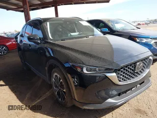 2022 Mazda CX-5 2.5 S Premium Package with VIN JM3KFBDM1N0603425, listed as a IAAI auction lot 41555280 with 61,497 mi miles. Bid and sale history available at carsss.com. Image 1.