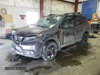 2021 Honda Passport Elite z VIN 5FNYF8H05MB021597, wystawiony jako Copart lot #44463515 z przebiegiem Nie podano mil oraz Szkoda całkowita • Salvage title. Historia ofert i sprzedaży dostępna na DreamBid. Obrazek 1.