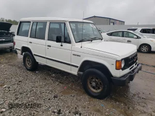 1990 Mitsubishi Montero z VIN JA4GJ31S2LJ003083, wystawiony jako Copart lot #73539314 z przebiegiem 115 191 mil mil oraz Nie do naprawy • Non repairable. Historia ofert i sprzedaży dostępna na DreamBid. Obrazek 4.