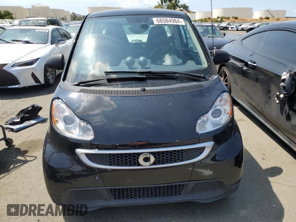 2014 Smart fortwo Passion z VIN WMEEJ9AA0EK788192, wystawiony jako Copart lot #68584984 z przebiegiem Nie podano mil oraz Szkoda całkowita • Salvage title. Historia ofert i sprzedaży dostępna na DreamBid. Obrazek 5.