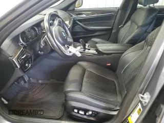 2018 BMW 5 Series M550i xDrive with VIN WBAJB9C55JB050213, listed as a Copart auction lot 61714255 with 34,700 mi miles and Salvage title. Bid and sale history available at DreamBid. Image 7.