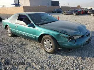 1997 Ford Thunderbird LX with VIN 1FALP62W4VH170423, listed as a Copart auction lot 83379614 with 93,117 mi miles and Salvage Title. Bid and sale history available at DreamBid. Image 4.