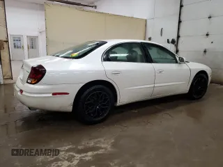2003 Oldsmobile Aurora z VIN 1G3GS64C534171677, wystawiony jako Copart lot #74768254 z przebiegiem 113 932 mil mil oraz Tytuł czysty. Historia ofert i sprzedaży dostępna na DreamBid. Obrazek 3.
