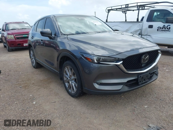 2021 Mazda CX-5 Grand Touring with VIN JM3KFBDM2M0431484, listed as a IAAI auction lot 42547665 with 34,757 mi miles and . Bid and sale history available at DreamBid. Image 1.
