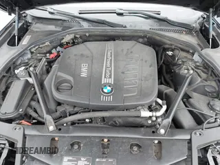 2014 BMW 5 Series 535d with VIN WBAXA5C59ED690375, listed as a IAAI auction lot 42030902 with 70,553 mi miles and . Bid and sale history available at carsss.com. Image 10.