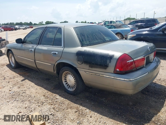 2002 Mercury Grand Marquis LS Premium z VIN 2MEFM75W22X617584, wystawiony jako IAAI lot #42444579 z przebiegiem 199 914 mil mil oraz . Historia ofert i sprzedaży dostępna na DreamBid. Obrazek 3.