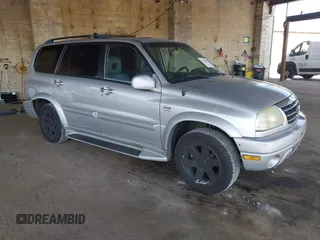 2003 Suzuki XL7 Touring z VIN JS3TX92V534109039, wystawiony jako IAAI lot #42112909 z przebiegiem 172 311 mil mil oraz . Historia ofert i sprzedaży dostępna na DreamBid. Obrazek 1.