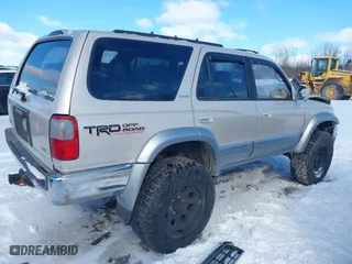 1998 Toyota 4Runner Limited with VIN JT3HN87R2W0184698, listed as a IAAI auction lot 41710285 with 176,068 mi miles. Bid and sale history available at carsss.com. Image 4.