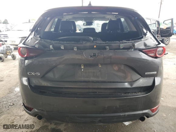 2020 Mazda CX-5 Touring with VIN JM3KFACM6L0797748, listed as a Copart auction lot 44573645 with 104,094 mi miles and Salvage Title. Bid and sale history available at carsss.com. Image 6.