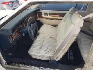 1985 Cadillac Eldorado z VIN 1G6EL5782FE630140, wystawiony jako Copart lot #76367454 z przebiegiem 29 850 mil mil oraz Szkody całkowita. Historia ofert i sprzedaży dostępna na DreamBid. Obrazek 7.
