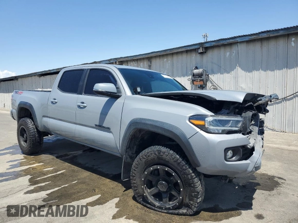 2020 Toyota Tacoma SR5 z VIN 3TMDZ5BN0LM094976, wystawiony jako Copart lot #58695515 z przebiegiem 84 025 mil mil oraz Czysty tytuł • Clean title. Historia ofert i sprzedaży dostępna na DreamBid. Obrazek 4.