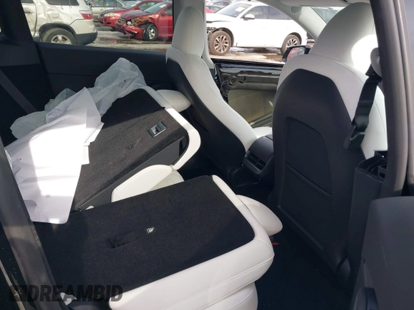 2023 Tesla Model Y Long Range z VIN 7SAYGDEE8PF826989, wystawiony jako IAAI lot #41615166 z przebiegiem 10 368 mil mil oraz . Historia ofert i sprzedaży dostępna na DreamBid. Obrazek 8.